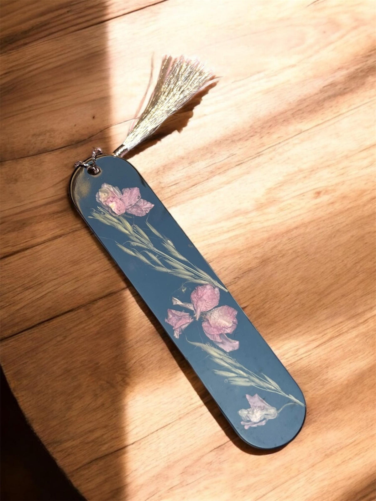 Real dried flowers sealed in resin bookmark